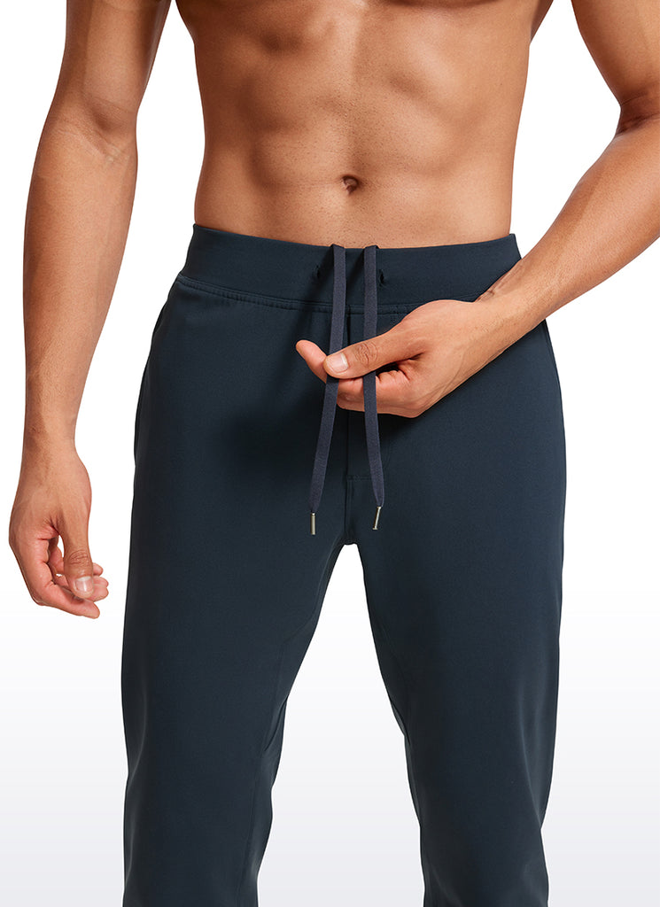 CRZ YOGA Men's Run Slim Fit On the Travel Joggers 30''- Ankle Zipper True Navy
