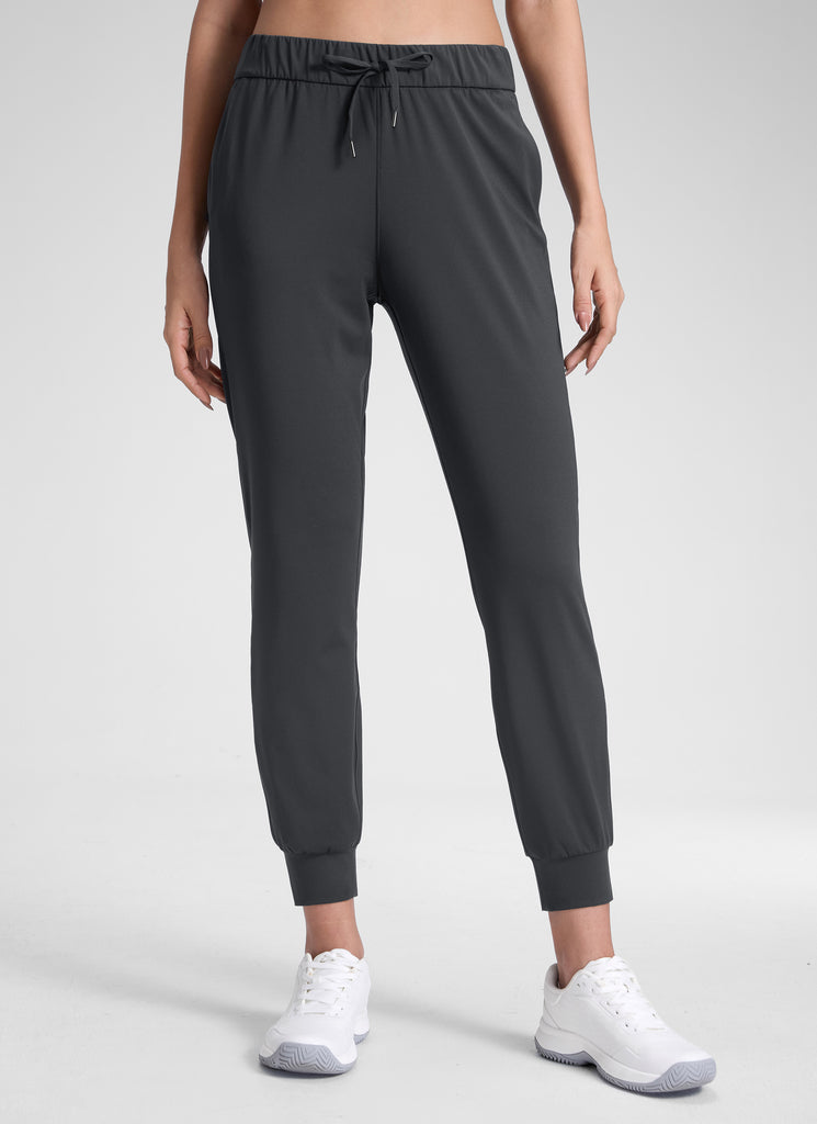 CRZ YOGA Women's Travel Slim Fit Stretch Drawstring Jogger 27'' Forest Dark Green