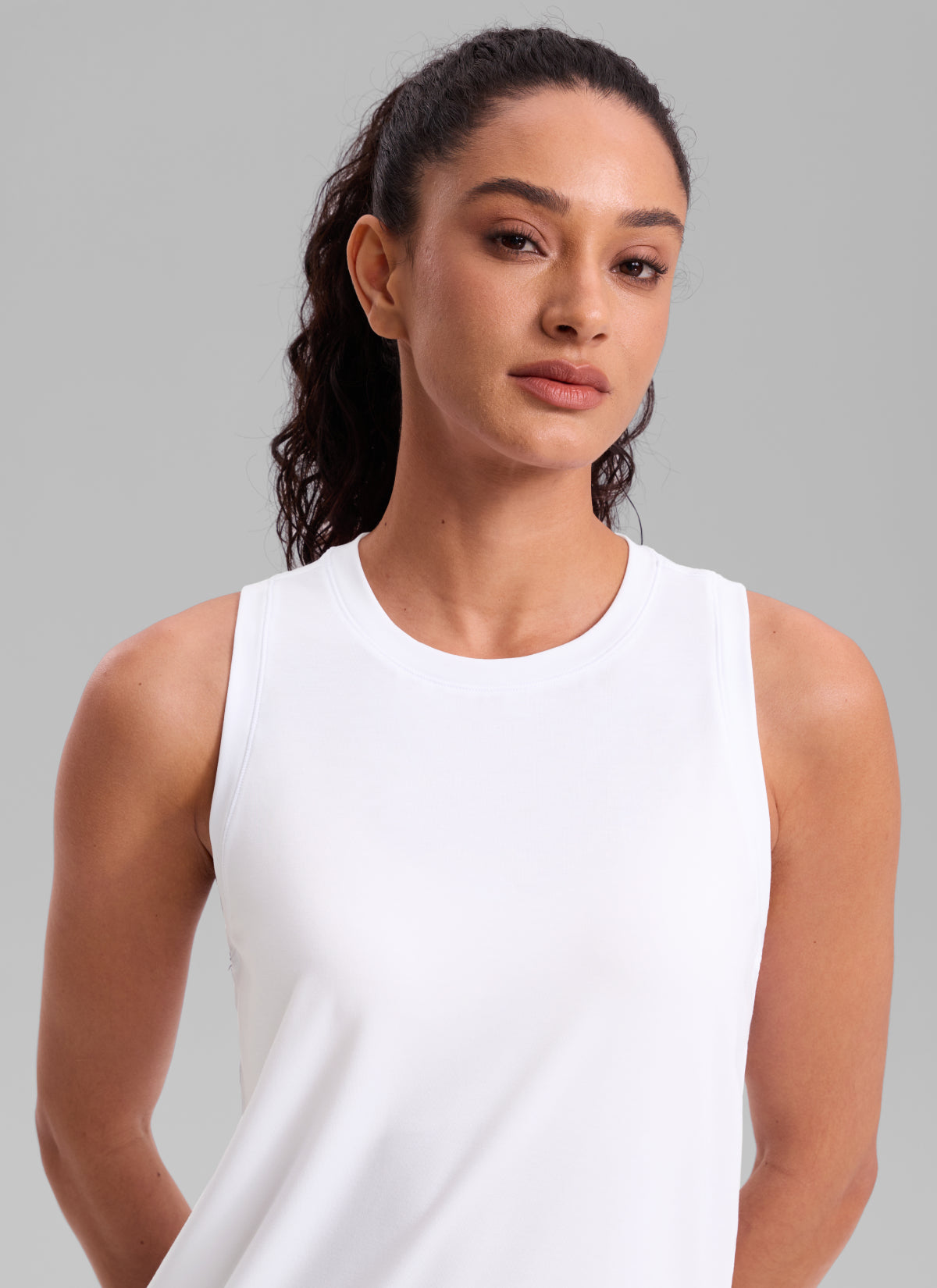 CRZ YOGA Women's Quick Dry Workout Crew Neck Racerback Hip Length Tank White @model_info:Larissa