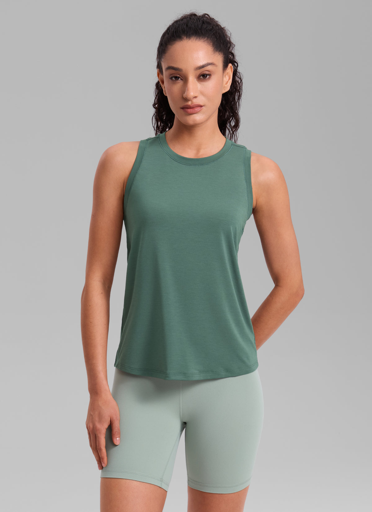 CRZ YOGA Women's Quick Dry Workout Crew Neck Racerback Hip Length Tank Graphite Green @model_info:Larissa