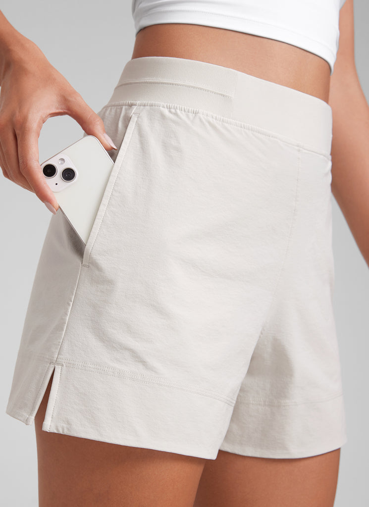 CRZ YOGA Women's Casual 4" Linerless High Waisted V Slit with Pockets Milky White